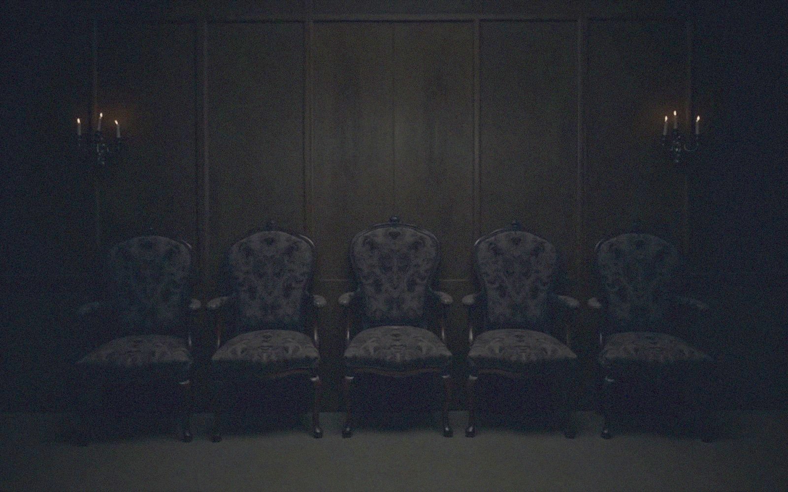 Candlelit still life evoking the film's cast
